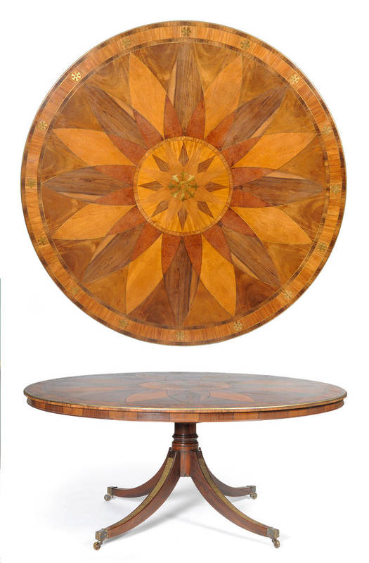 Lot 1303 - A Large Regency Style Mahogany Circular Specimen Wood Dining Table, the brass strung top...