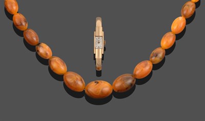 Lot 3300 - A Pressed Amber Necklace, forty-one graduated beads of pressed amber, length 76cm; and A Lady's...