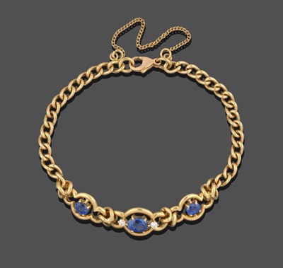 Lot 3316 - An 18 Carat Gold Sapphire and Diamond Bracelet, the central link with an oval cut sapphire...