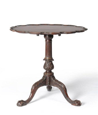 Lot 1306 - A George II Style Mahogany Tripod Table, the scalloped flip top raised on a fluted and acanthus...