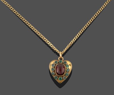 Lot 3331 - A Garnet and Emerald Pendant on Chain, the heart shaped pendant with a cabochon garnet centrally in