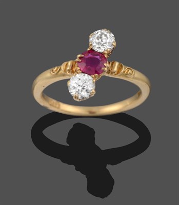 Lot 3333 - A Ruby and Diamond Three Stone Ring, a round cut ruby flanked by two old cut diamonds in yellow...