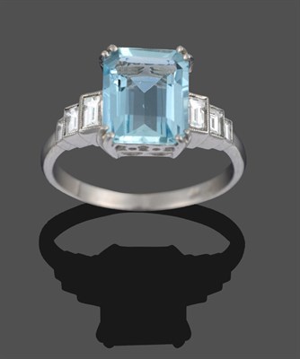 Lot 3351 - An Art Deco Style Aquamarine and Diamond Ring, an emerald-cut aquamarine in a white double claw...