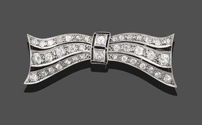 Lot 3355 - An Art Deco Diamond Bow Brooch, three undulating ribbons set throughout with graduated old cut...