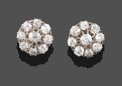 Lot 3360 - A Pair of Diamond Cluster Earrings, a raised central old cut diamond within a border of smaller old