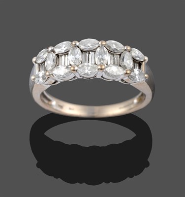 Lot 3361 - An 18 Carat White Gold Diamond Ring, five pairs of baguette cut diamonds within borders of marquise