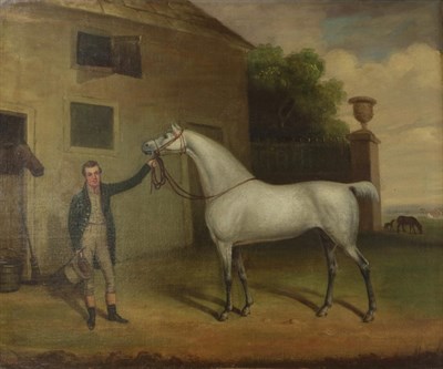 Lot 2037 - Follower of Harry Hall (1814-1882) Groom with white stallion in stable yard Oil on canvas, 62cm...