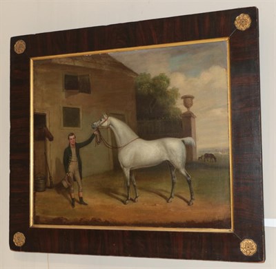 Lot 2037 - Follower of Harry Hall (1814-1882) Groom with white stallion in stable yard Oil on canvas, 62cm...