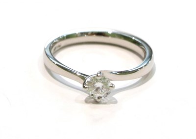 Lot 224 - A platinum diamond solitaire ring, a round brilliant cut diamond in a claw setting, to bypass...