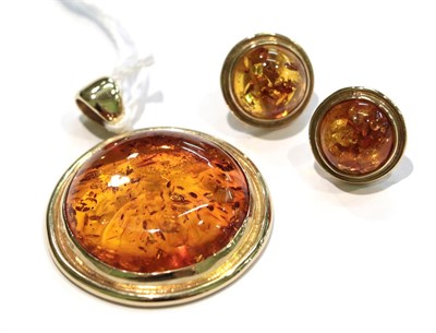 Lot 226 - A pair of 9 carat gold amber earrings, the round amber cabochons in yellow rubbed over...