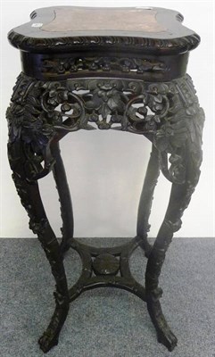 Lot 1321 - A Chinese Pink Marble and Padouk Wood Plant Stand, circa 1900, with foliate carved frieze,...