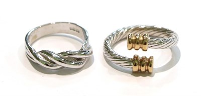 Lot 244 - A 9 carat two colour textured gold torque ring, finger size J; and a 9 carat white gold twist ring