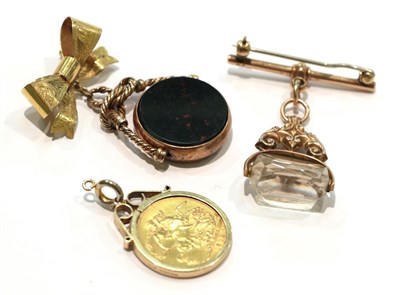 Lot 247 - A 1912 sovereign mounted as a pendant; a 9 carat gold hardstone swivel fob; and another 9 carat...