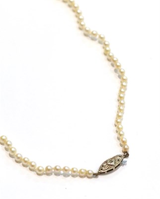 Lot 251 - A graduated cultured pearl necklace, clasp stamped '9' and '.375', length 52cm