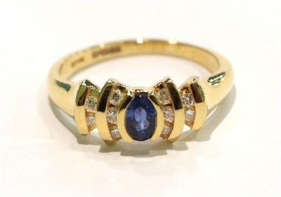 Lot 254 - An 18 carat gold sapphire and diamond ring, finger size M