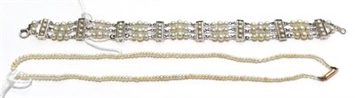 Lot 261 - A three row cultured pearl bracelet with cultured pearl panels at intervals, the catch loop is...