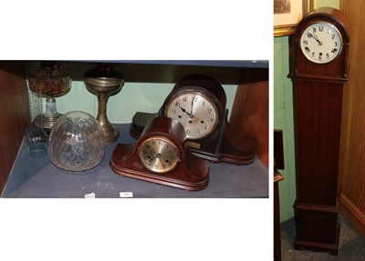 Lot 287 - A small chiming Art Deco longcase clock together with a chiming Art Deco mantel clock, striking...