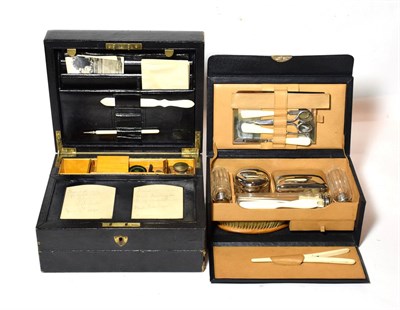 Lot 303 - A early 20th century cased dressing set, together with a domed travel writing slope