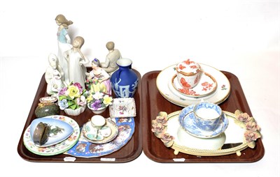 Lot 310 - A Herend patterned covered cup and saucer, together with a Lladro and Nao figures, modern...