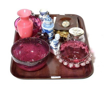 Lot 316 - A collection of cranberry glass together with studio glass bowl and modern Delft, and portrait...