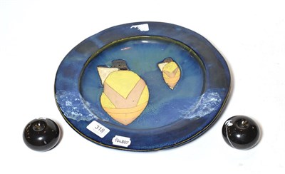 Lot 318 - A Studio pottery dish decorated with boats, together with two black marble apples