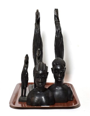 Lot 321 - Two 20th century African carved hardwood busts; together with a pair of carved cranes on plinth...