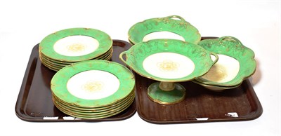 Lot 322 - A Wedgwood part dessert service, green ground with gilt decoration (two trays)