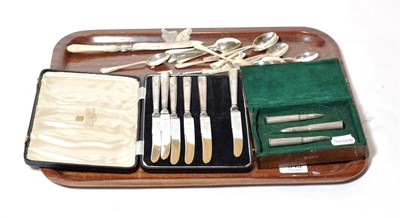 Lot 343 - A set of six silver-handled butter knives, Viners of Sheffield; a set of twelve silver tea and...