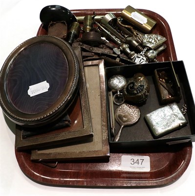 Lot 347 - Three silver photograph frames; a silver sovereign case; a silver vesta case; a brass rams head...