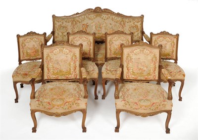 Lot 1333 - A Louis XV Style Walnut and Parcel Gilt Aubusson Settee, with leaf and flower carved frame, the...