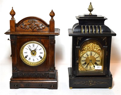 Lot 361 - 'Fattorini & Sons, Bradford' mantel clock and a striking ebonised mantel clock (2)