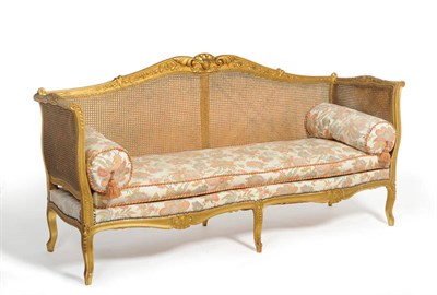 Lot 1335 - A Louis XV Style Gilt Painted and Beech Canapé, circa 1900, the acanthus leaf carved frame...