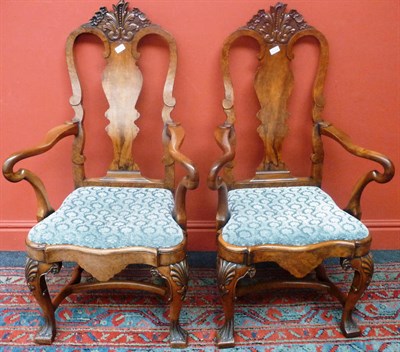 Lot 1338 - A Pair of Early Georgian Style Walnut Armchairs, circa 1930, with carved top rail and vasiform...