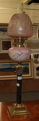 Lot 420 - Oil lamp with painted satin glass font and pink shade