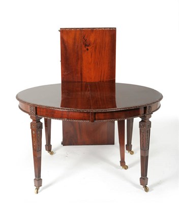 Lot 1351 - An Adams Revival Mahogany Extending Dining Table, circa 1900, with two D ends extending on a...