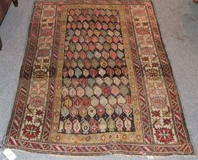 Lot 1142 - A Kuba rug, the charcoal field with rows of boteh enclosed by harshang borders, 147cm by 108cm