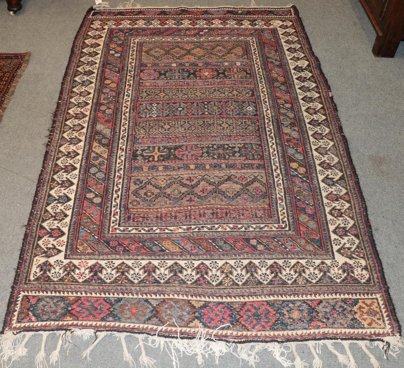 Lot 1145 - Afshar flatweave rug, the walnut brown and indigo field of bands of geometric motifs enclosed...
