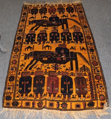 Lot 1150 - Baluch Pictorial rug, depicting anthropomorphic and zoomorphic figures framed by stylised...