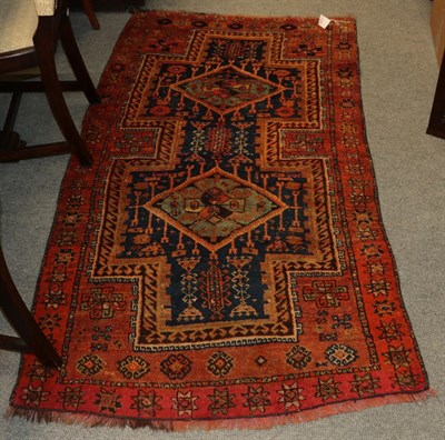 Lot 1151 - Yuruk rug, the indigo field with two diamond medallions enclosed by stellar motif borders, 191cm by