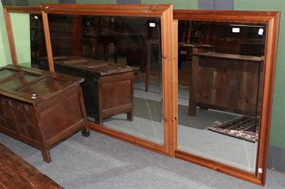 Lot 1164 - Three modern pine framed bevelled glass mirrors