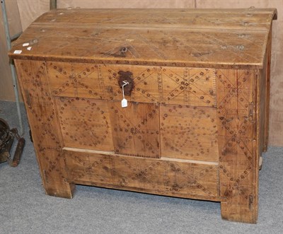 Lot 1169 - A 19th century Swedish Scandinavian pine dome top trunk, with repeating patterns, on stile...