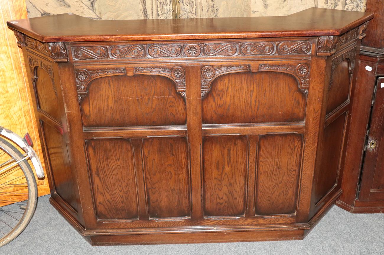 Lot 1173 - An early 20th century oak carved bar