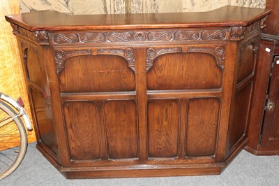 Lot 1173 - An early 20th century oak carved bar
