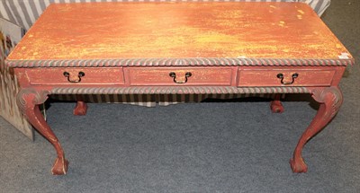 Lot 1183 - A 20th century, carved serving table, with gadrooned edges with three frieze drawers above cabriole