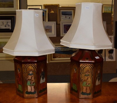 Lot 1193 - A pair of toleware decorative table lamps