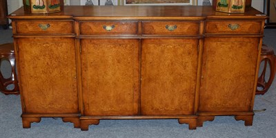 Lot 1197 - A 20th century walnut feather and banded break-front sideboard, 182cm wide