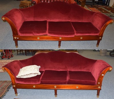 Lot 1198 - Two hump-back settees covered in red velvet, made by Anthony Nixon bespoke furniture maker, Barnard