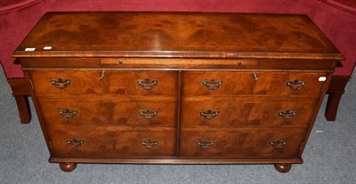 Lot 1202 - A 20th century walnut veneered feather banded sideboard of small proportions, 138cm wide