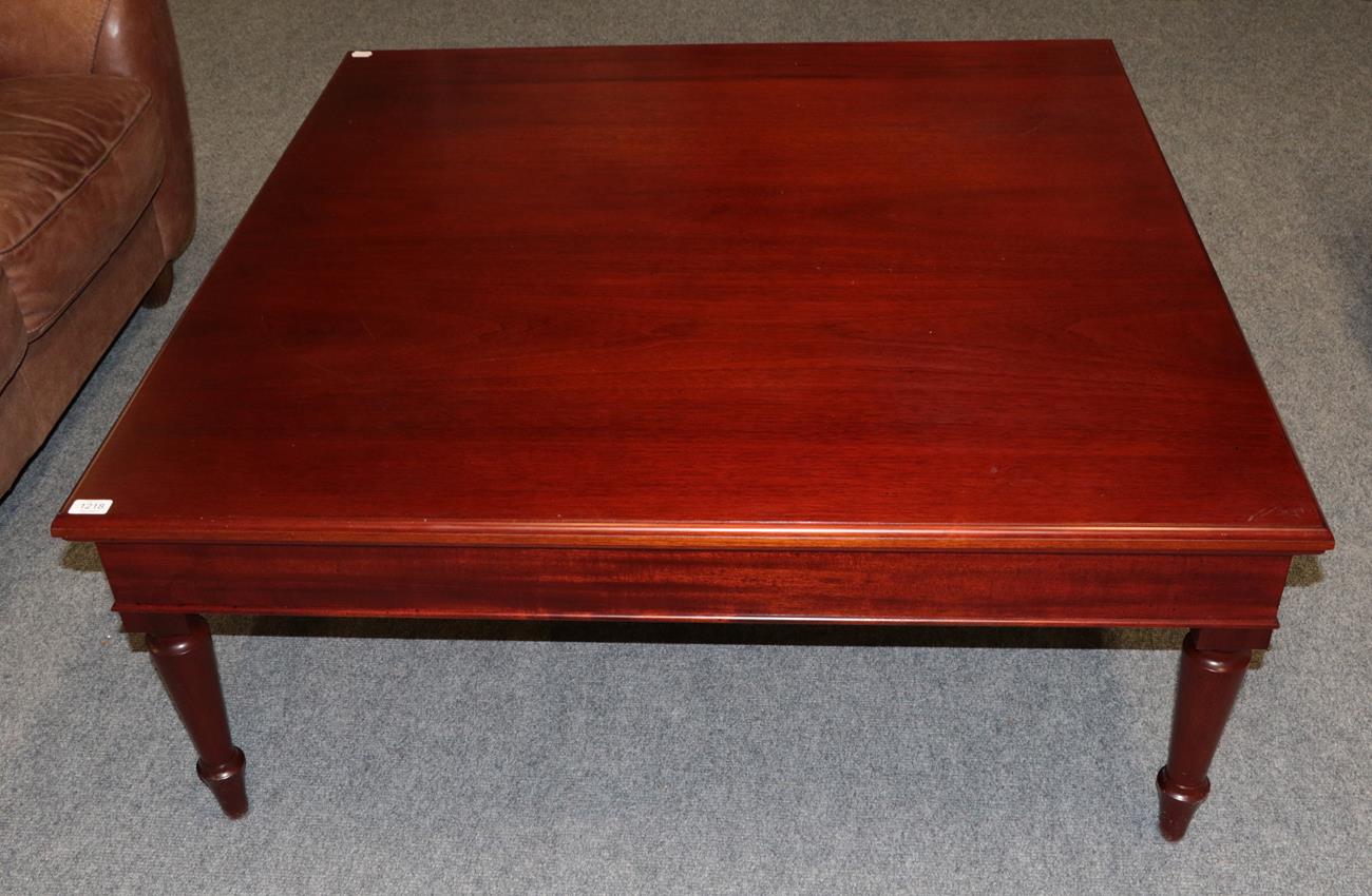 Lot 1218 A large square mahogany coffee table on