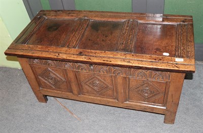 Lot 1232 - A late 17th century panelled oak kist, carved detail, 107cm wide